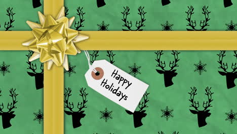 animación de cintas y formas abstractas cambiantes y texto de felices fiestas en la caja de regalos
