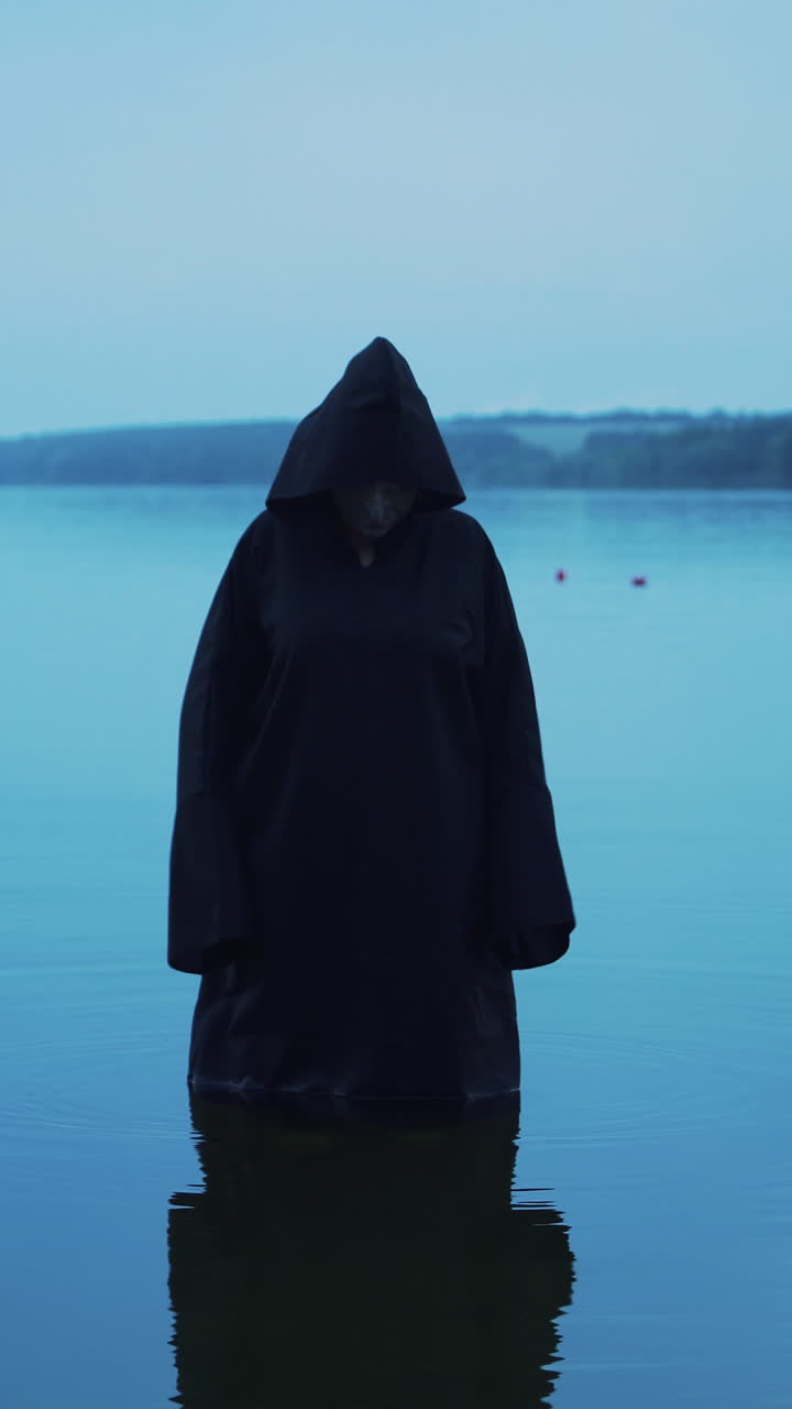 Evil ghost in the water. Halloween costume Vertical video