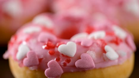 heart shaped sprinkled pink donuts.