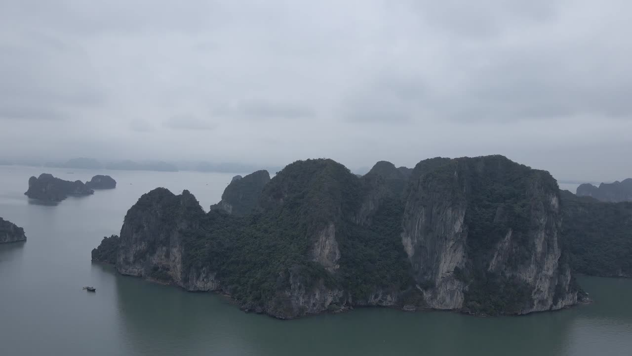 A breathtaking aerial view of Hạ Long Bay’s towering limestone karsts rising from emerald waters. This UNESCO World Heritage site showcases Vietnam’s most iconic natural seascape of islands