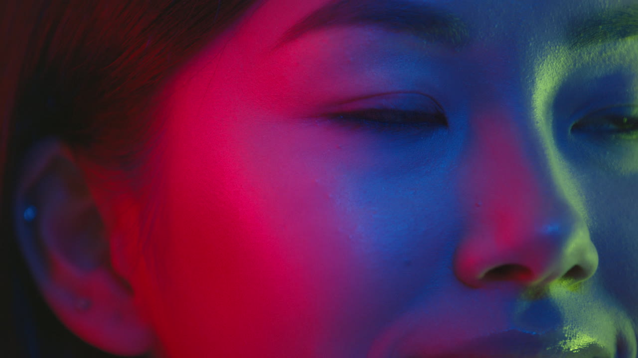Close-up Portrait of a Woman with Neon Lighting