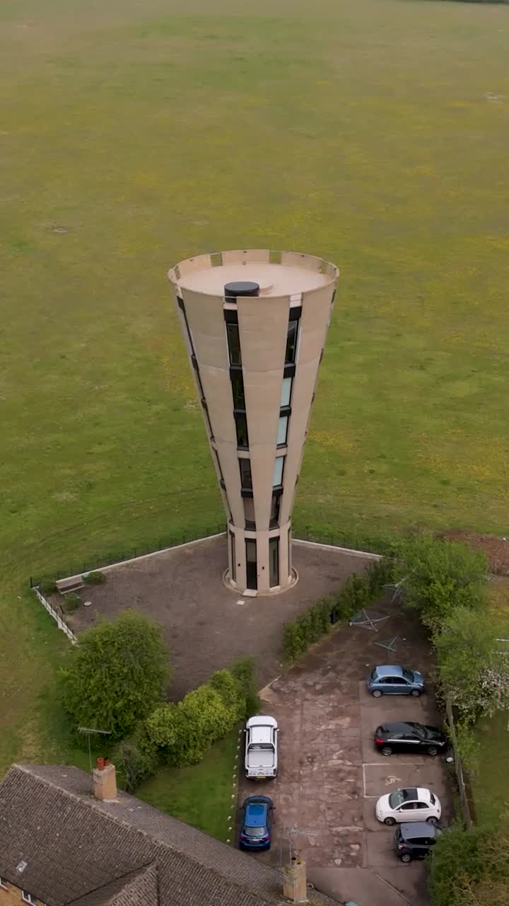 Vertical orbiting descending drone by Tonwell Water Tower, Hertfordshire, England
