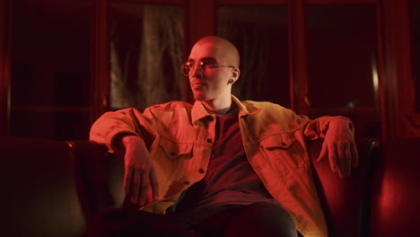 man in a yellow jacket, red light portrait