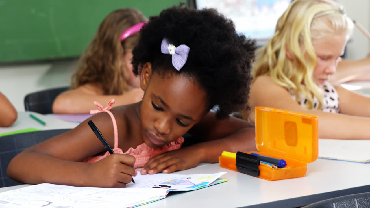 School kids doing homework in classroom