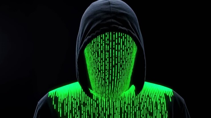 A shadowy figure cloaked in a dark hoodie is deeply immersed in interacting with shimmering digital codes within an enigmatic cyber landscape