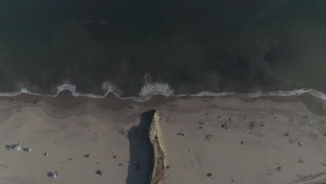 aerial - overhead of beach cliff