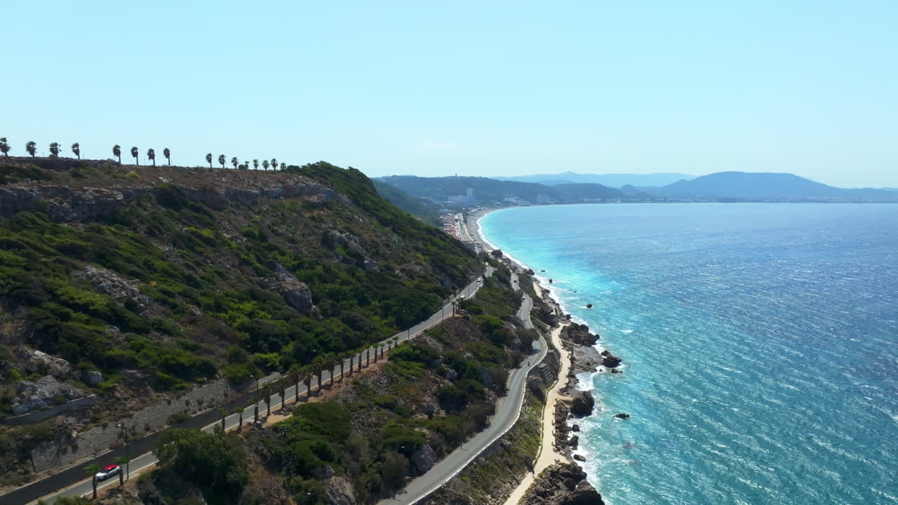 Aerial view flying along the coastline of Rhodes, bright, sunny day in Greece