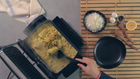 An-aerial-view-of-a-chef-cooking-Thai-fish,-a-traditional-Asian-food