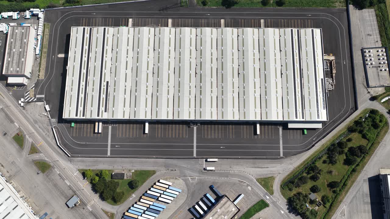 logistical trucking distribution center in Northern Italy. Top down aerial video on company building