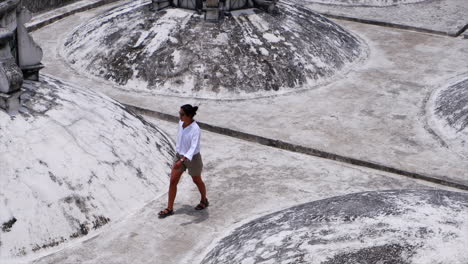 Woman-explores-old-white-roof-top-domes-of-Leon-Cathedral-in-Nicaragua