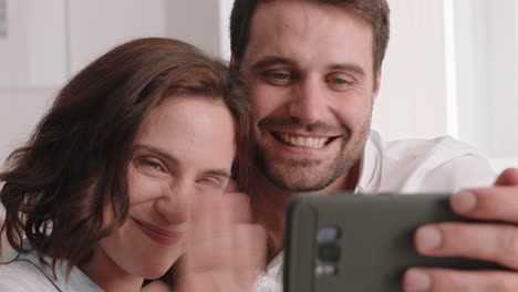 happy couple having video chat using smartphone chatting to friend smiling excited enjoying online communication on mobile phone