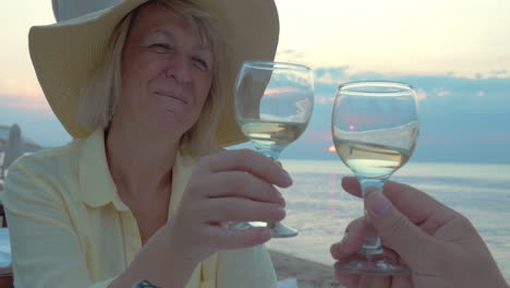 Smiling-Woman-Listening-a-Toast-and-Drinking-Wine