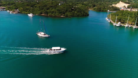 aerial: dive boat on tropical island