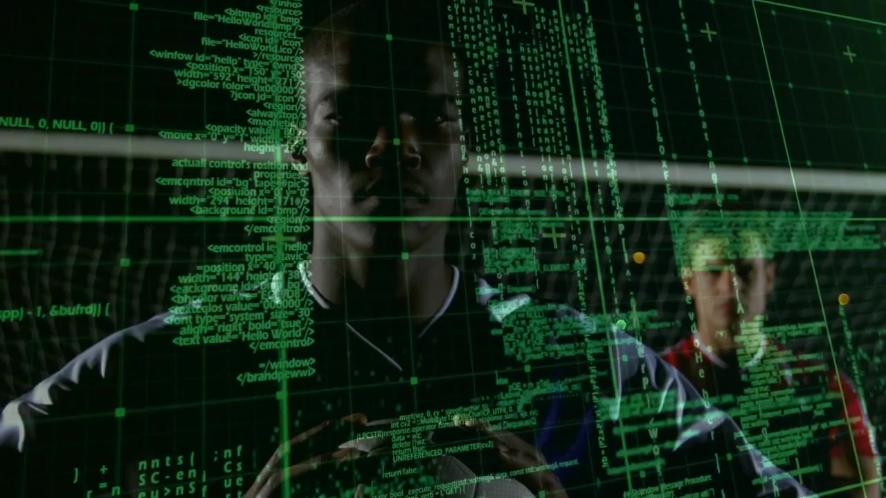 Male soccer player floodlit while holding ball with green data grid fading scanning sports metrics