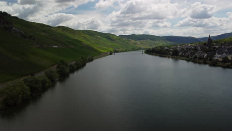 flight over lake mosel next to a villlage and vineyard