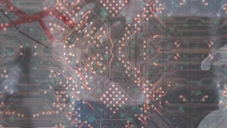 animation of microprocessor connections and red graphs moving over close of hand using sanitizer