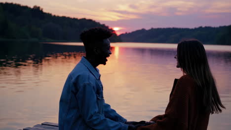 couple enjoying sunset by the lake