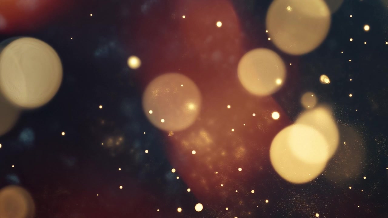 Sfondo con luci bokeh calde e particelle scintillanti