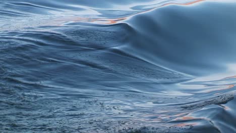 mediumshot of waves generated by a boat's wake