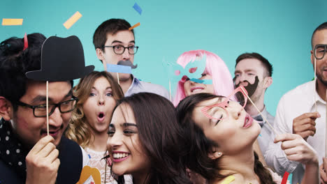 Multi-racial-group-of-funny-people-celebrating-slow-motion-party-photo-booth