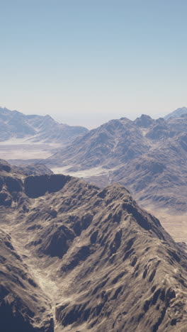 aerial view of a rugged mountain range in a desert landscape