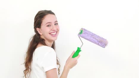 Pretty-teen-painting-white-wall