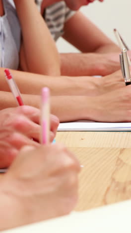 students sitting in class taking notes