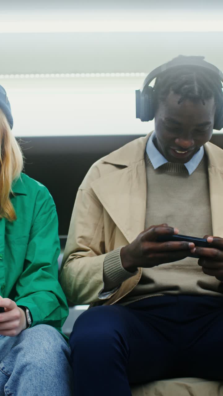 Young People Playing Games on Mobile Phones