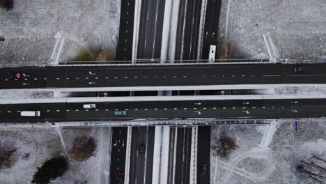aerial shot of a busy winter highway as the drone ascends and rotates smoothly
