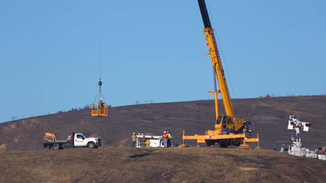 A-SCE-telephone-lineman-maintenance-crew-works-on-power-lines-on-burned-hills-following-the-disastrous-Thomas-Fire-3