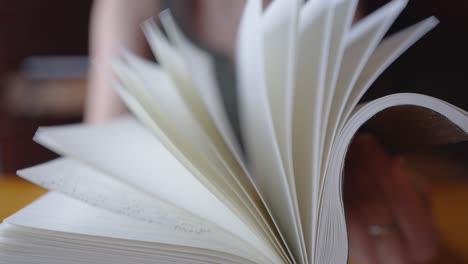 student flips through the pages of their notebook