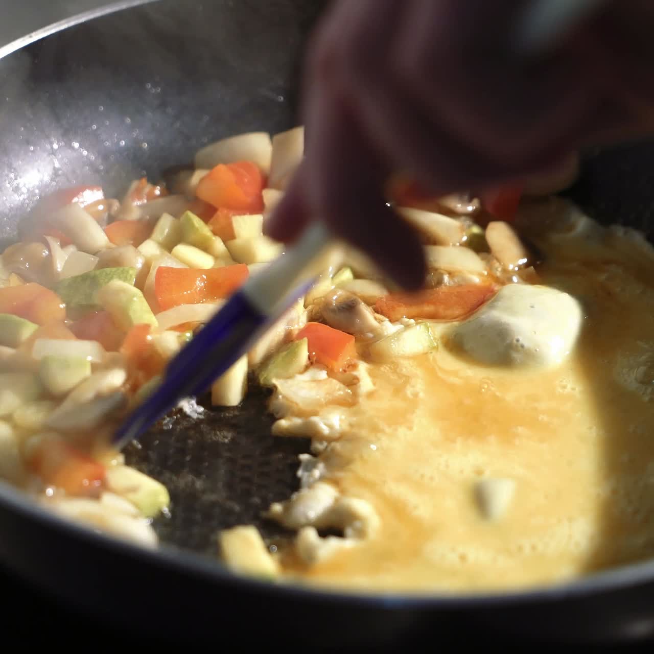 Stewed sliced vegetables in pan