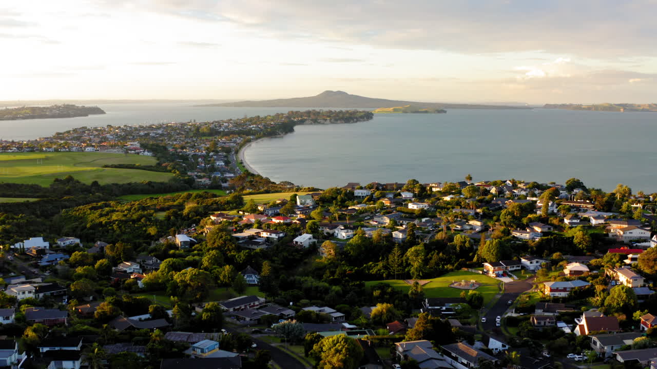 Aerial View of Coastal Suburb and Bay with Distant Island