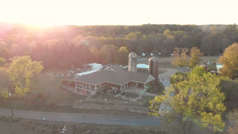 aerial view of farm building at sunset