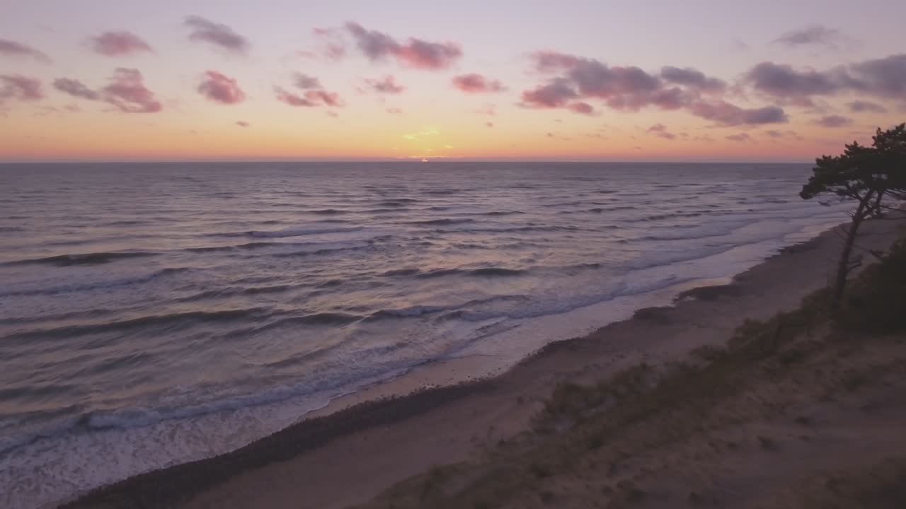Baltic Sea Coast In Latvia at Sunset. Aerial Track Right Down Shot