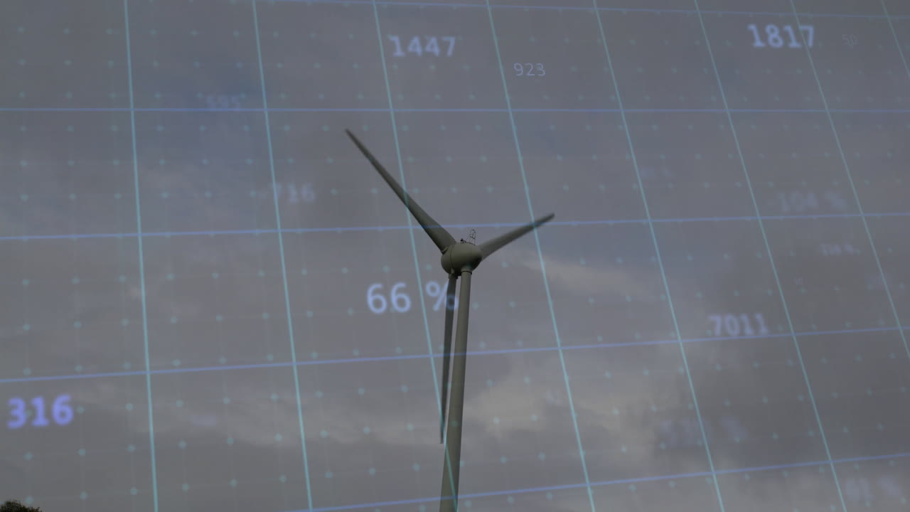 Wind turbine standing under cloudy sky, displaying translucent grid overlay with numeric data