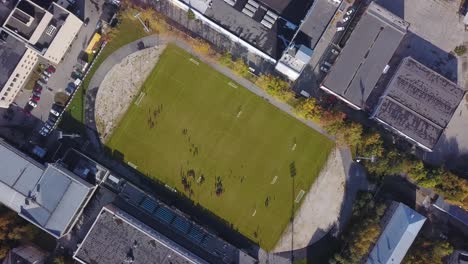 aerial view of a football field in an urban setting