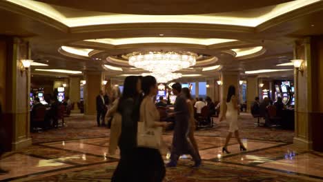 a bustling casino scene with players engaged at slot machines and stylish patrons strolling amidst a luxurious interior