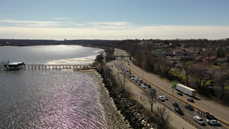 an aerial shot beside a parkway with traffic because of an automobile accident