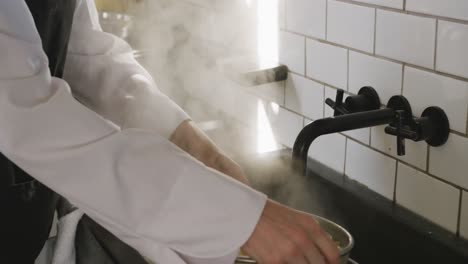 chef wringing the pasta