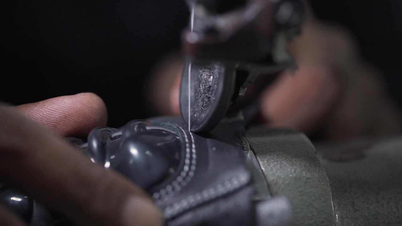 Closeup Of Sweatshop Worker Sewing Leather Sporting Gloves, Clothing Industry Manufacturing