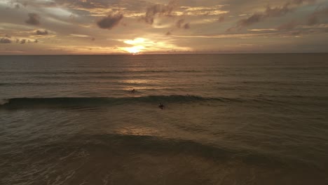 vibing on the surf in thailand during sunset.