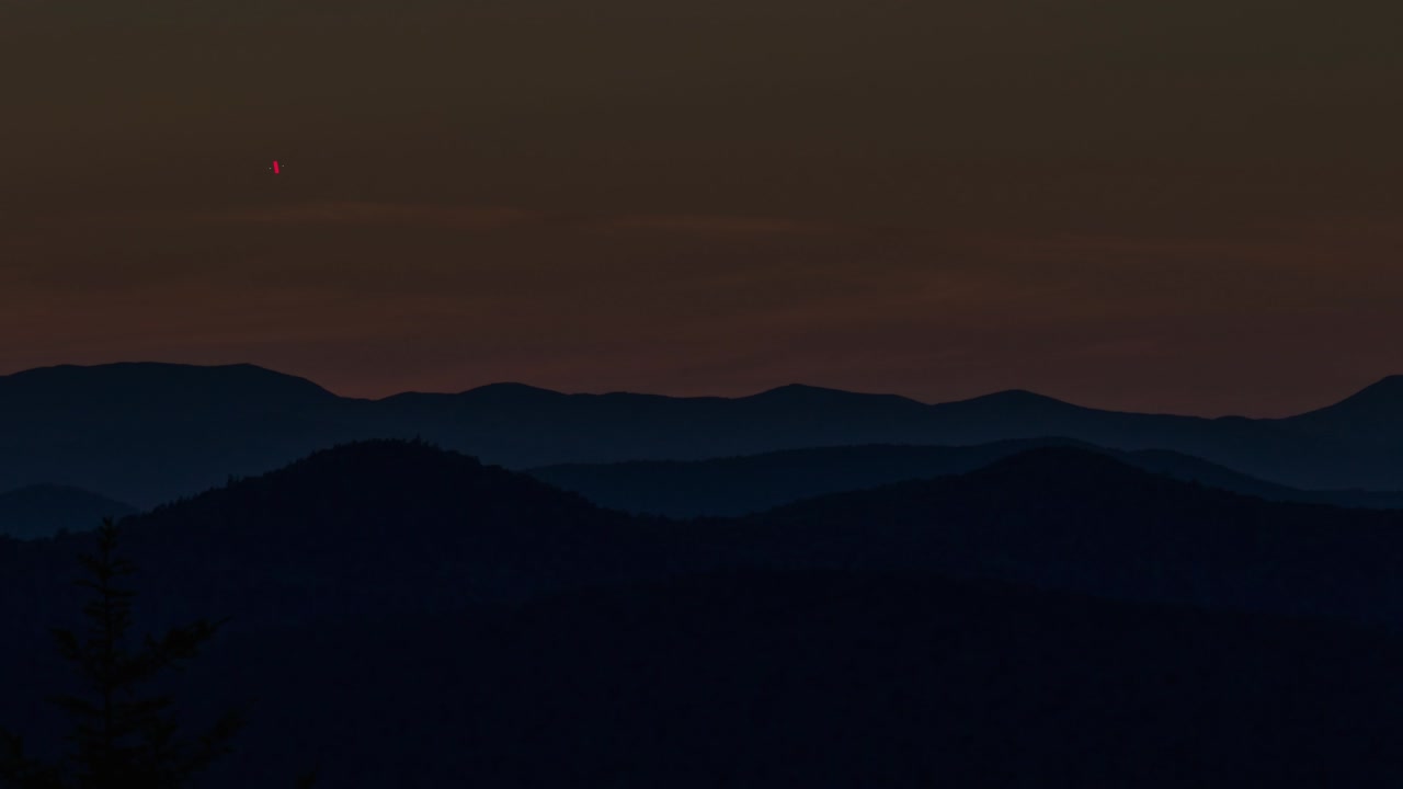 Mountain Silhouette at Twilight with Red Squares