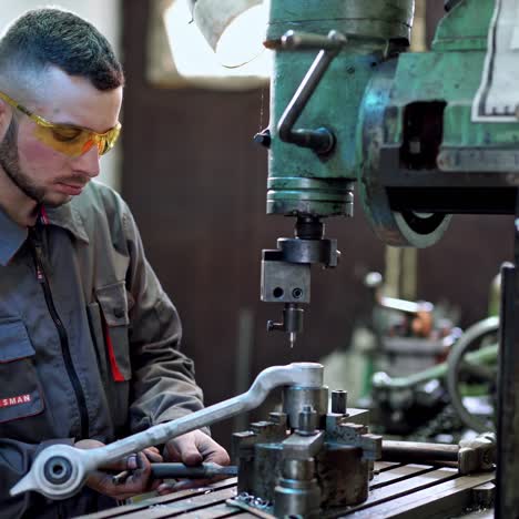 worker in factory at machine