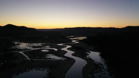 sunrise over a winding river in a wetland