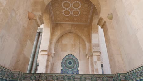 beautiful details of hassan ii mosque in casablanca, morocco tilt down establish