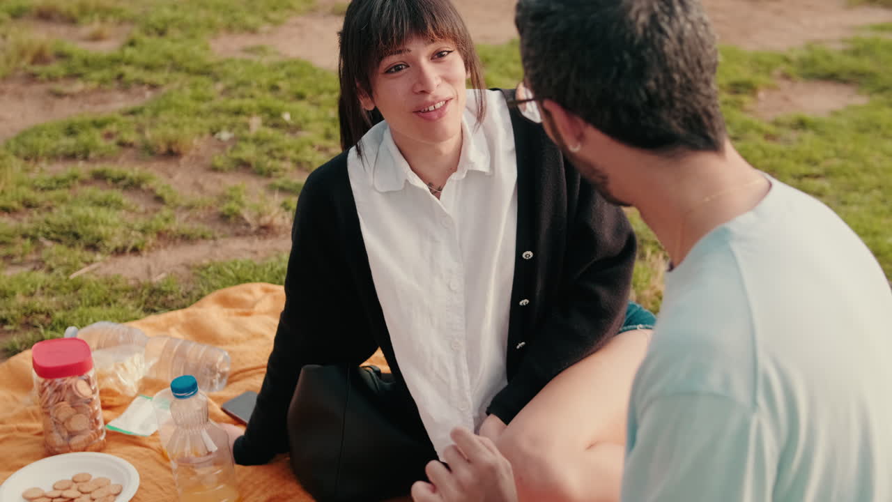 Friends Enjoy a Relaxing Picnic in the Park