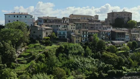 aerial over the old town of capodimonte on lake bolsena, province of viterbo, italy