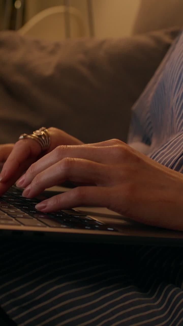 Woman Working on Laptop at Night