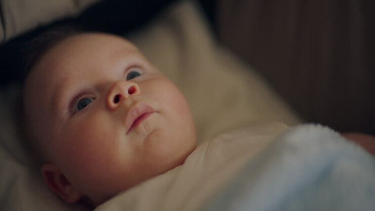 Adorable baby in crib